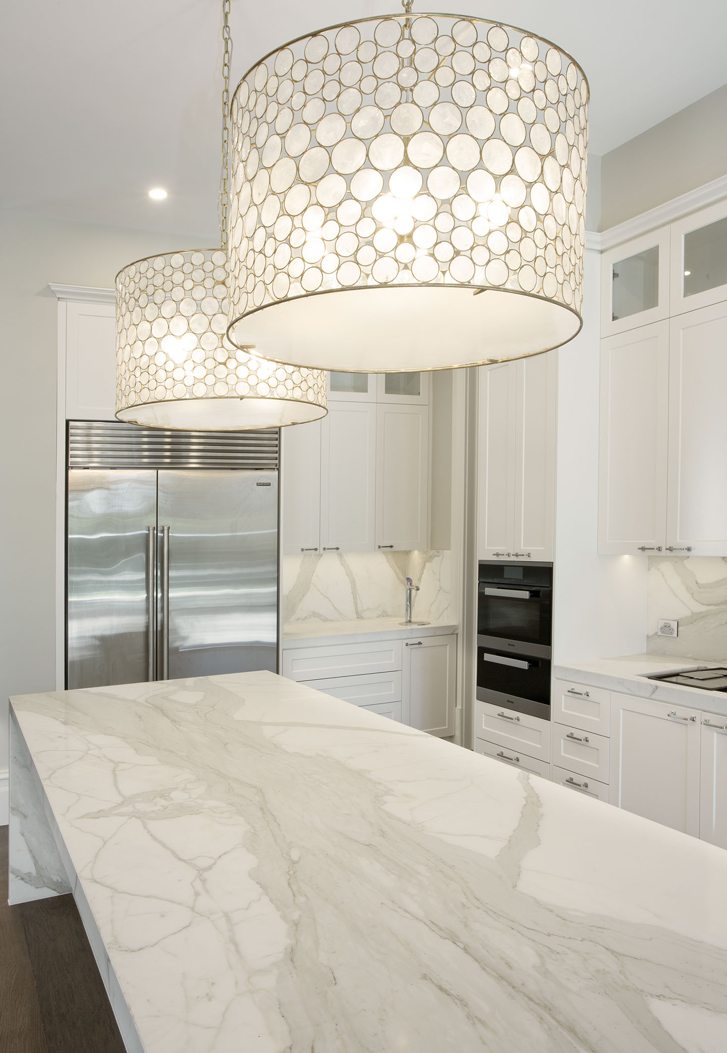 Calcutta mable stone work with white 2 pack cabinets